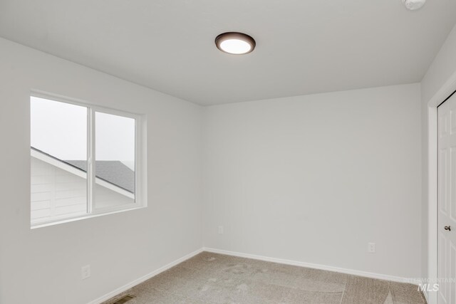 2219 W Cascara St, Kuna, ID 83634 - carpeted empty room featuring visible vents and baseboards