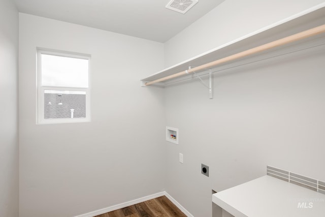 washroom with hookup for a washing machine, dark hardwood / wood-style flooring, and electric dryer hookup