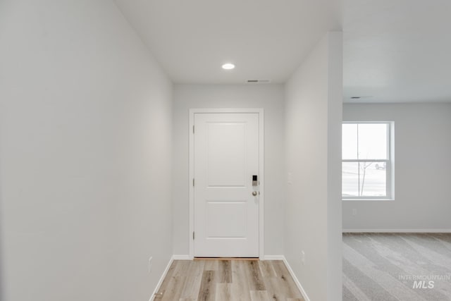2219 W Cascara St, Kuna, ID 83634 - doorway with baseboards, wood finished floors, and visible vents