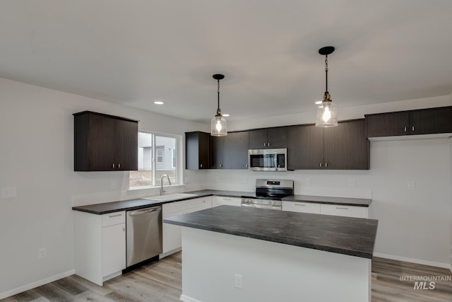 2219 W Cascara St, Kuna, ID 83634 - kitchen with black appliances, light brown cabinetry, a sink, and light countertops