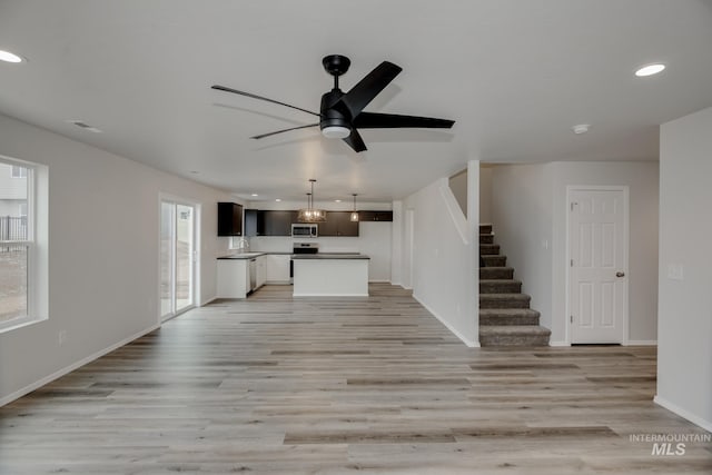 2219 W Cascara St, Kuna, ID 83634 - kitchen with dishwasher, light countertops, and a kitchen island