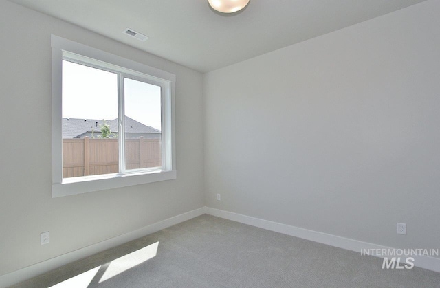 spare room featuring carpet floors