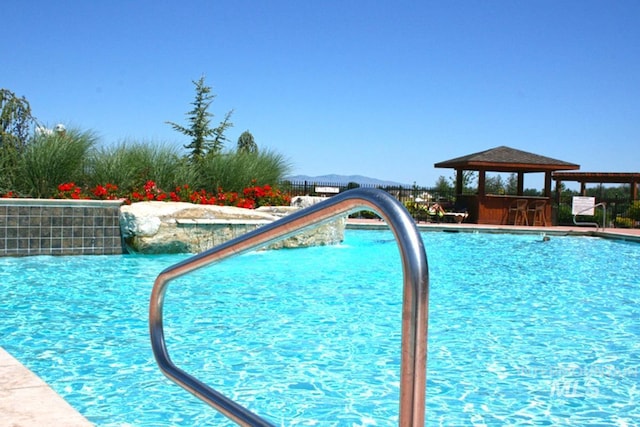 view of swimming pool featuring a gazebo