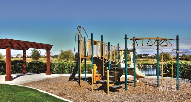 view of playground with a water view