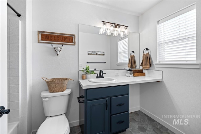 full bath with baseboards, toilet,  shower combination, and vanity