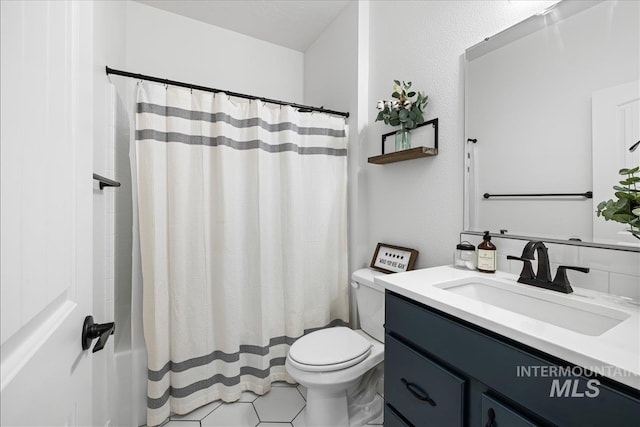 bathroom featuring vanity, toilet, and shower / bath combo with shower curtain