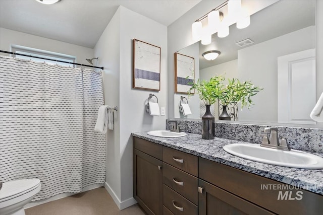 2252 E Tiger Lily Dr, Boise, ID 83716 - bathroom with double vanity, toilet, and curtained shower
