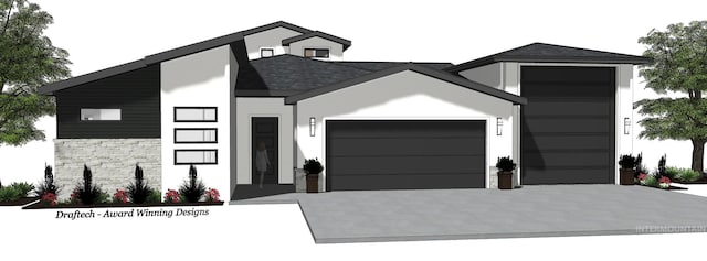view of front facade with a garage, concrete driveway, and stone siding