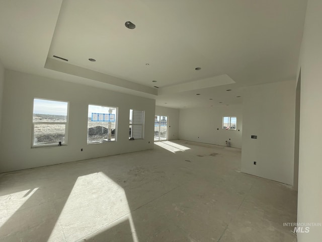 spare room featuring a tray ceiling