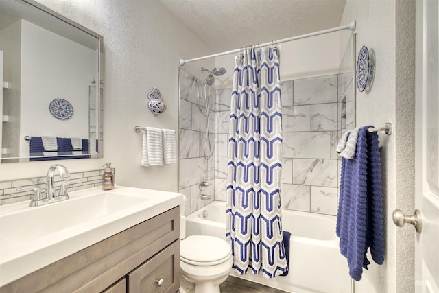 full bath featuring shower / tub combo with curtain, toilet, a textured wall, and vanity