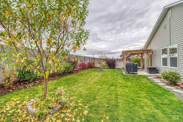 view of yard with a pergola and a patio area