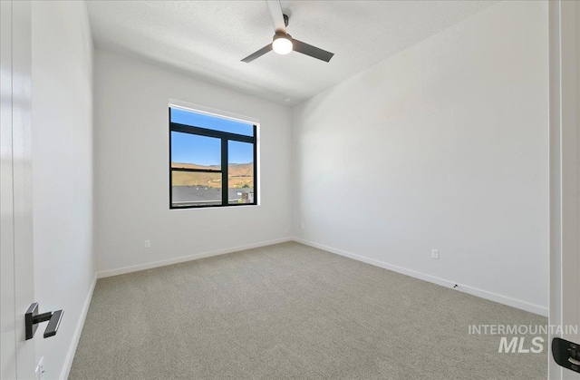 4340 E Haystack St Unit 304, Boise, ID 83716 - spare room featuring carpet, ceiling fan, and baseboards