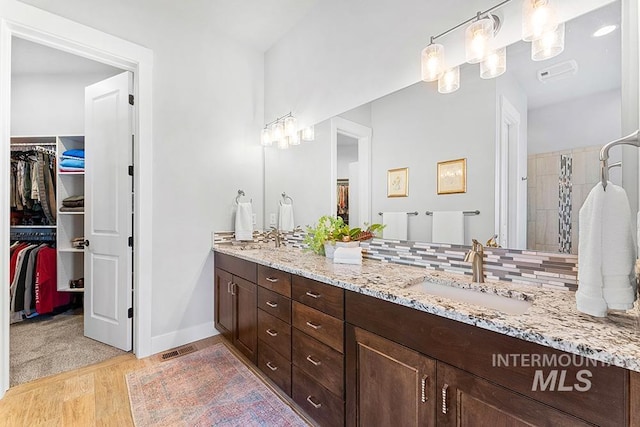 bathroom with vanity and hardwood / wood-style flooring