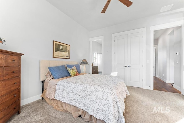 bedroom with ceiling fan, carpet flooring, and a closet