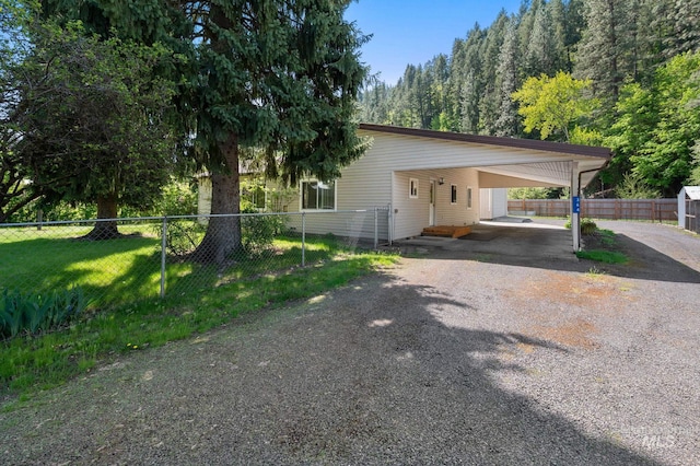 view of front of home featuring fence and driveway