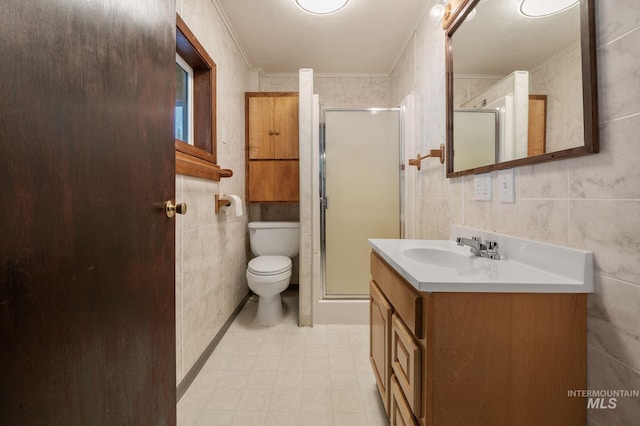full bathroom featuring toilet, a stall shower, tile walls, vanity, and ornamental molding