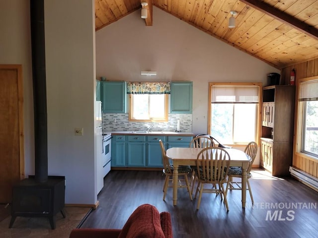 dining space featuring wood ceiling, vaulted ceiling with beams, baseboard heating, a wood stove, and dark wood-style floors