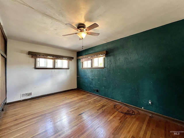 278 Taylor St, Twin Falls, ID 83301 - spare room with a ceiling fan, wood finished floors, and baseboards