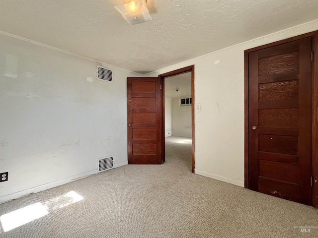 278 Taylor St, Twin Falls, ID 83301 - spare room with carpet, baseboards, a textured ceiling, and crown molding