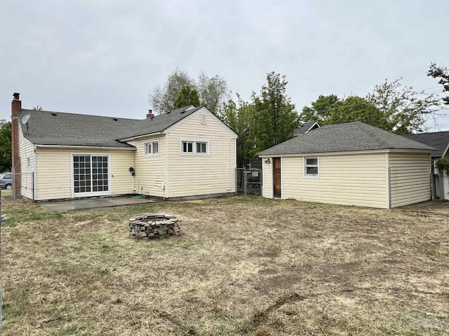 278 Taylor St, Twin Falls, ID 83301 - back of property featuring a fire pit and a chimney