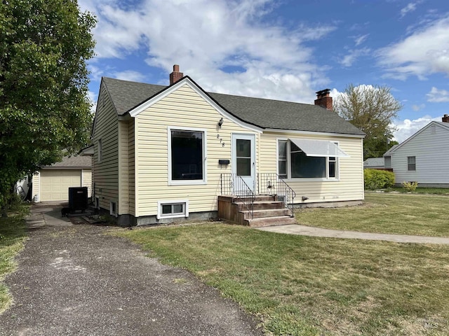 278 Taylor St, Twin Falls, ID 83301 - bungalow-style home featuring cooling unit, asphalt driveway, a chimney, and roof with shingles