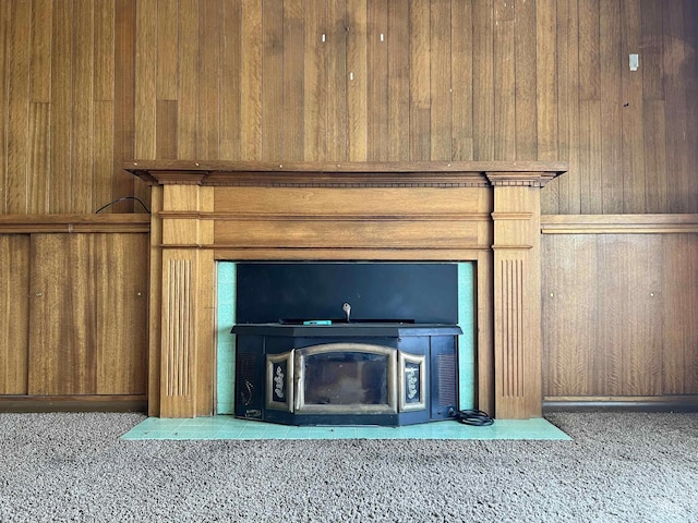 278 Taylor St, Twin Falls, ID 83301 - detailed view of wooden walls, carpet floors, and a glass covered fireplace