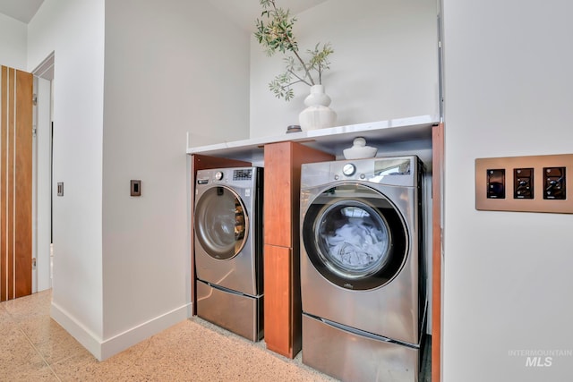 laundry area featuring washing machine and dryer