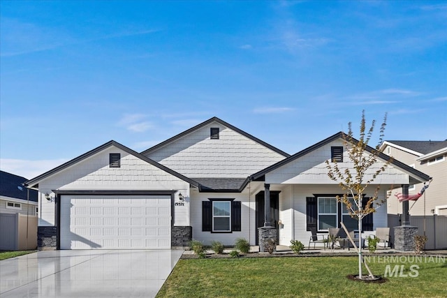 19321 Geneva Way, Caldwell, ID 83605 - view of front of home featuring concrete driveway, a front lawn, fence, a porch, and a garage