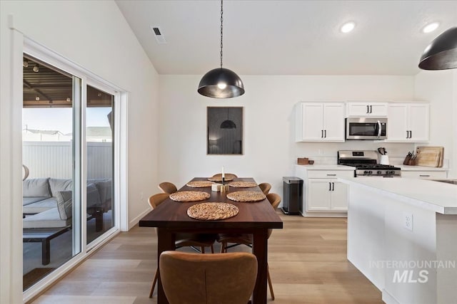 19321 Geneva Way, Caldwell, ID 83605 - kitchen featuring visible vents, white cabinetry, light wood-style floors, light countertops, and appliances with stainless steel finishes