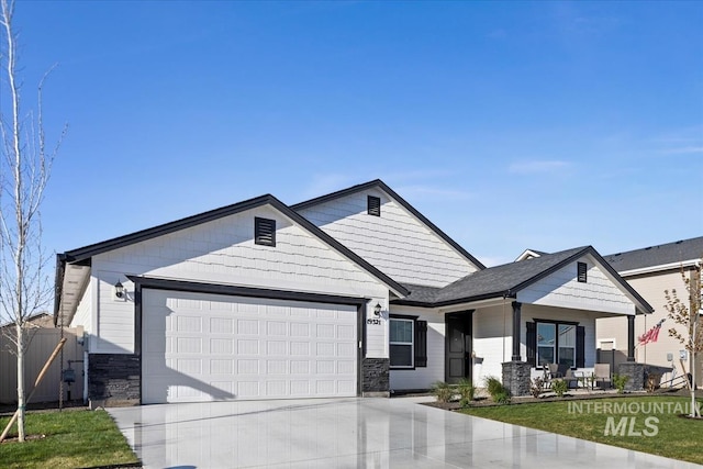 19321 Geneva Way, Caldwell, ID 83605 - view of front facade with an attached garage, driveway, and stone siding