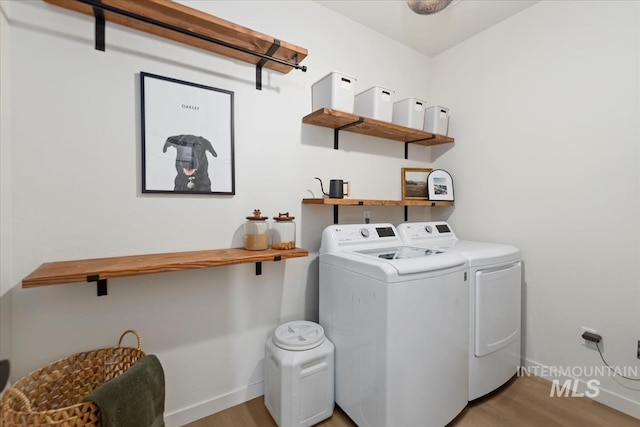 19321 Geneva Way, Caldwell, ID 83605 - laundry area with light wood finished floors, baseboards, independent washer and dryer, and laundry area