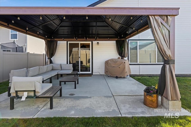 19321 Geneva Way, Caldwell, ID 83605 - view of patio featuring a gazebo, an outdoor hangout area, area for grilling, and fence