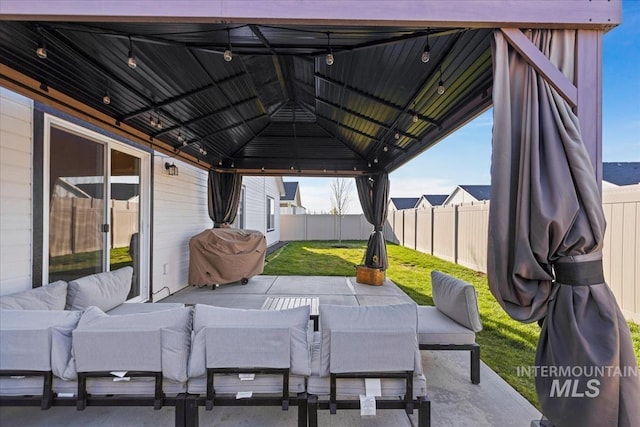 19321 Geneva Way, Caldwell, ID 83605 - view of patio featuring a fenced backyard, outdoor lounge area, a gazebo, and area for grilling