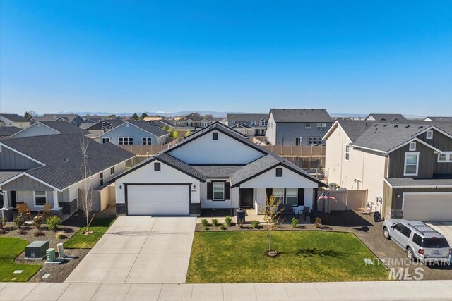 19321 Geneva Way, Caldwell, ID 83605 - ranch-style house featuring a front lawn, driveway, fence, a garage, and a residential view