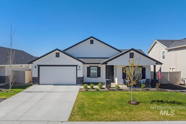 19321 Geneva Way, Caldwell, ID 83605 - view of front of property with fence, concrete driveway, an attached garage, a porch, and a front yard