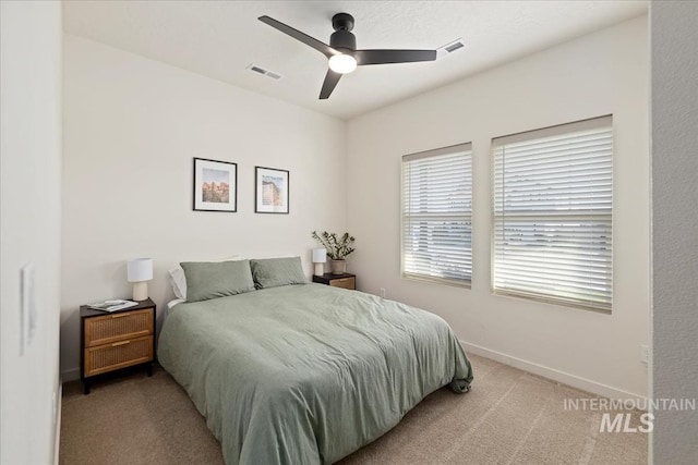 19321 Geneva Way, Caldwell, ID 83605 - bedroom featuring baseboards, visible vents, light colored carpet, and ceiling fan