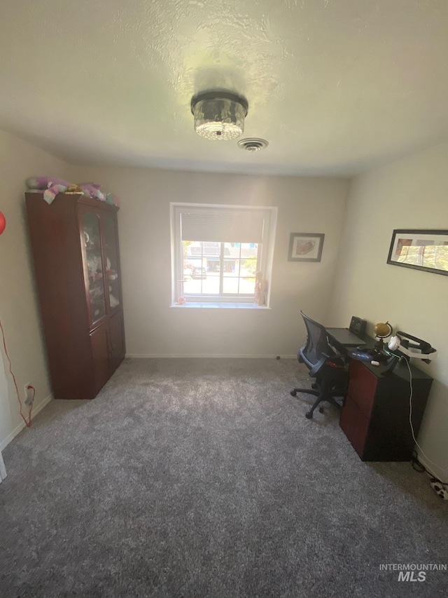 office area featuring carpet, baseboards, and visible vents