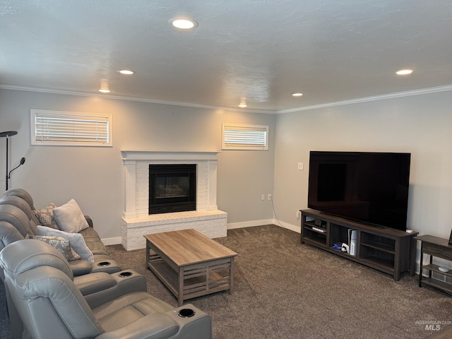 living area with recessed lighting, a brick fireplace, dark colored carpet, and crown molding
