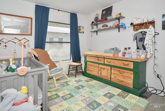 1713 Blaine St, Caldwell, ID 83605 - bedroom with light carpet and a nursery area
