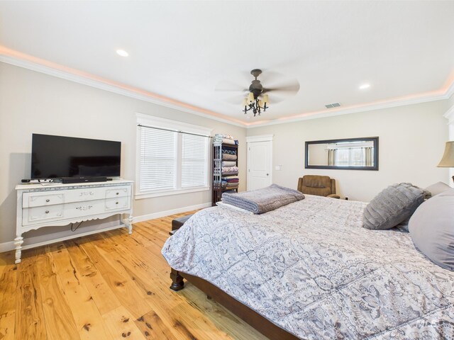 bedroom with ornamental molding, baseboards, wood finished floors, a ceiling fan, and recessed lighting
