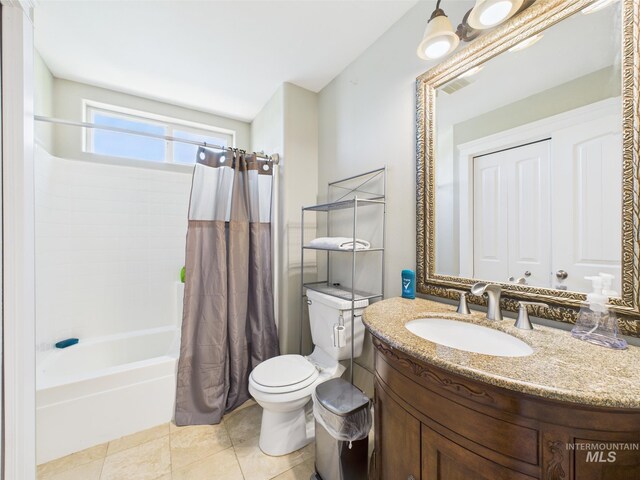 full bathroom with toilet, shower / bath combo, vanity, and tile patterned flooring