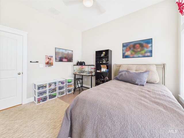 bedroom with a ceiling fan and baseboards
