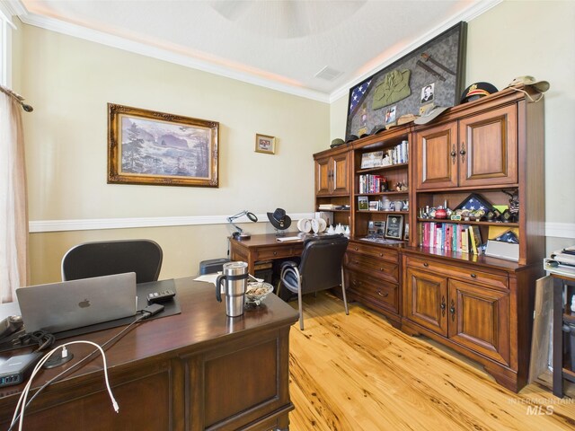 office featuring crown molding and light wood finished floors