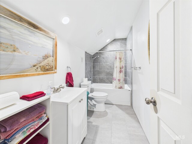 bathroom with shower / tub combo with curtain, vanity, toilet, vaulted ceiling, and tile patterned floors