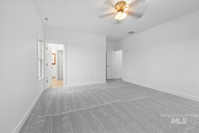 unfurnished bedroom with light carpet and ceiling fan