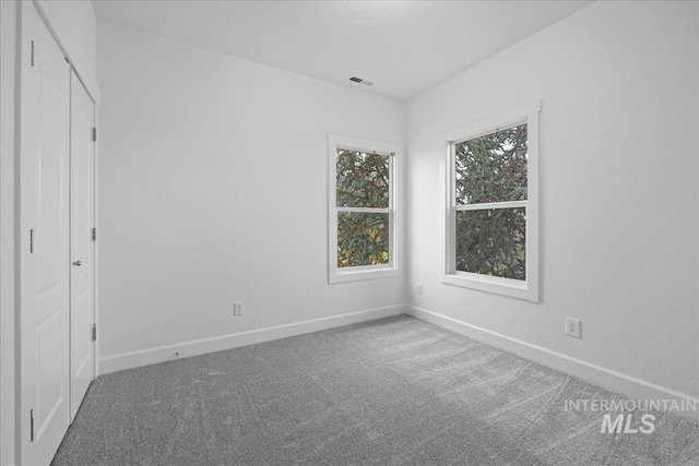 unfurnished bedroom featuring carpet floors