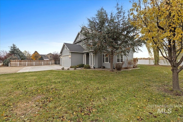 exterior space with a yard and a garage