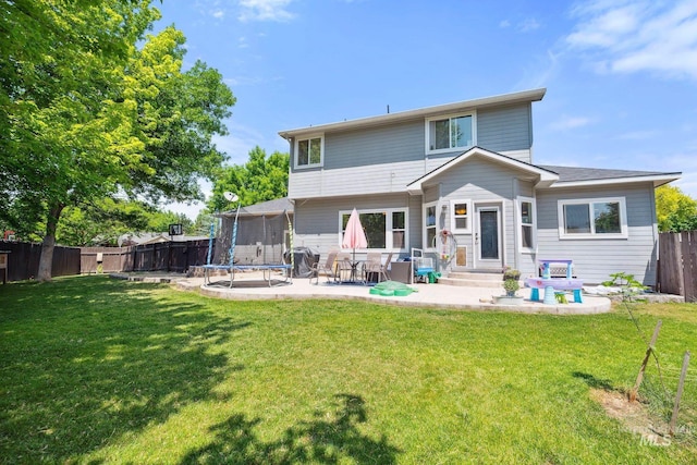 1229 N Hiltonhead Way, Eagle, ID 83616 - back of property featuring a trampoline, entry steps, and a patio area
