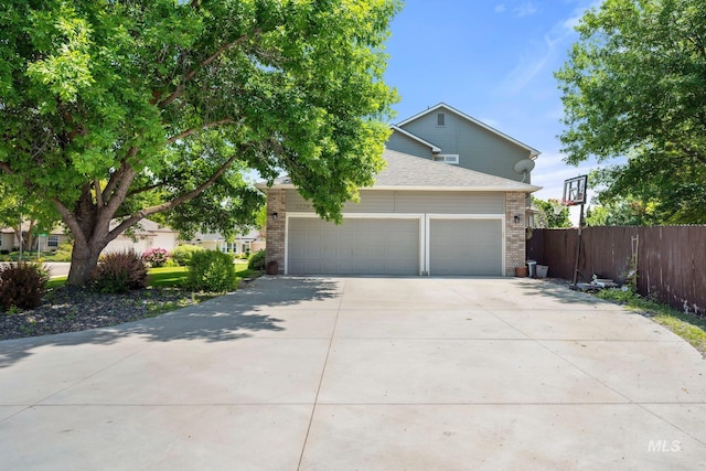 1229 N Hiltonhead Way, Eagle, ID 83616 - view of front of property with concrete driveway, a garage, brick siding, and a shingled roof