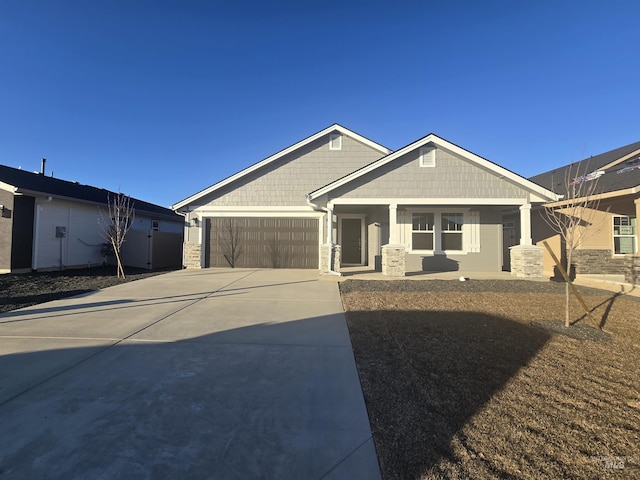 view of front of property with a garage and a porch